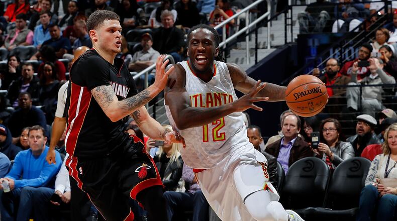 Taurean Prince of the Atlanta Hawks drives against Tyler Johnson of the Miami Heat at Philips Arena on December 7, 2016 in Atlanta, Georgia. (Photo by Kevin C. Cox/Getty Images)