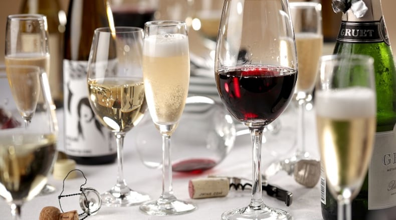 Just one white and one red? Not at our Thanskgiving. Get a variety of inexpensive bottles, and let your guests dirty as many glasses as they want. (Michael Tercha/Chicago Tribune/TNS)