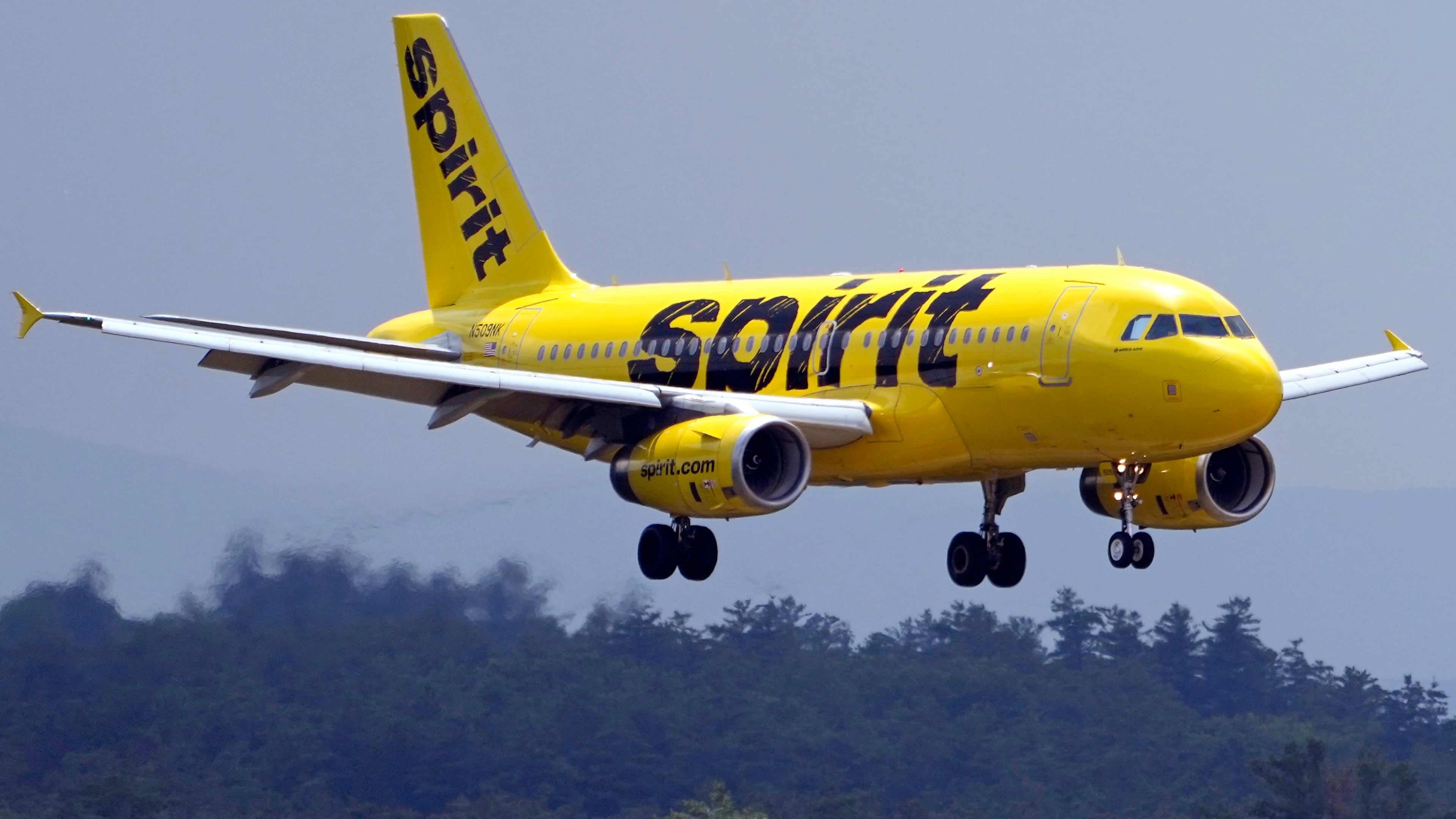 FILE - A Spirit Airlines 319 Airbus approaches Manchester Boston Regional Airport for a landing, Friday, June 2, 2023, in Manchester, N.H. (AP Photo/Charles Krupa, File)