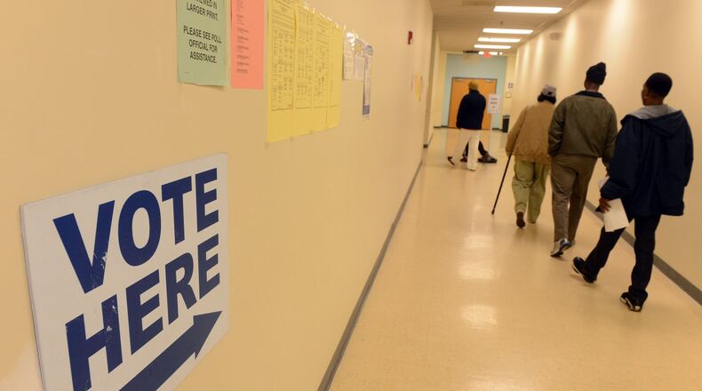 November 1, 2012 DECATUR Signs direct voters to the polls at the Dekalb Voter Registrations and Elections offices on Memorial Drive in Decatur Thursday November 1, 2012.White voters continue to lose clout in Georgia. For the first time in state history, they make up less than 60 percent of registered voters expected to participate in this year's presidential election, according to new numbers from the Secretary of State's office. Among "active" registered voters, blacks remained steady at about 30 percent. The biggest difference, however, came from a growing pool of voters who declined to identify themselves by race or ethnicity. One caution: These numbers excluded some registered voters because of inactivity, although they remain eligible to vote in Georgia. KENT D. JOHNSON / AJC