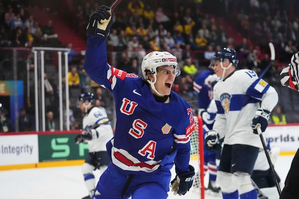 The United States' Zeev Buium celebrates after scoring against Finland during the second period of a quarterfinal match at the ice hockey world championships in Stockholm, Sweden, Thursday, May 22, 2025. (AP Photo/Petr David Josek)