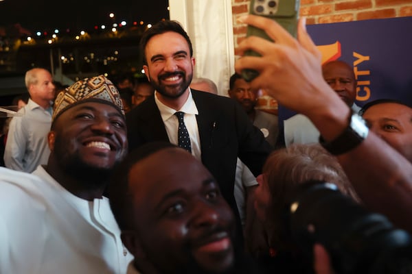 Democratic mayoral candidate Zohran Mamdani poses for photos with supporters after winning the primary election in New York City on Tuesday.