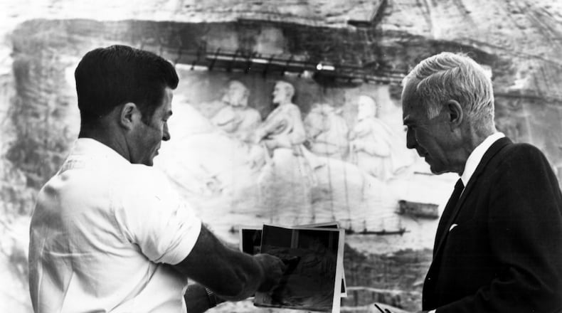 Chief carver Roy Faulkner (left) and sculptor Walker Hancock review plans for completion of the Stone Mountain Memorial Carving in the 1960s. Hancock was the final consulting sculptor to supervise work on the mommoth sculpture.