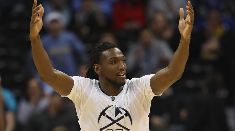 Kenneth Faried of the Denver Nuggets celebrates a basket against the Portland Trail Blazers at the Pepsi Center on December 15, 2016 in Denver, Colorado.