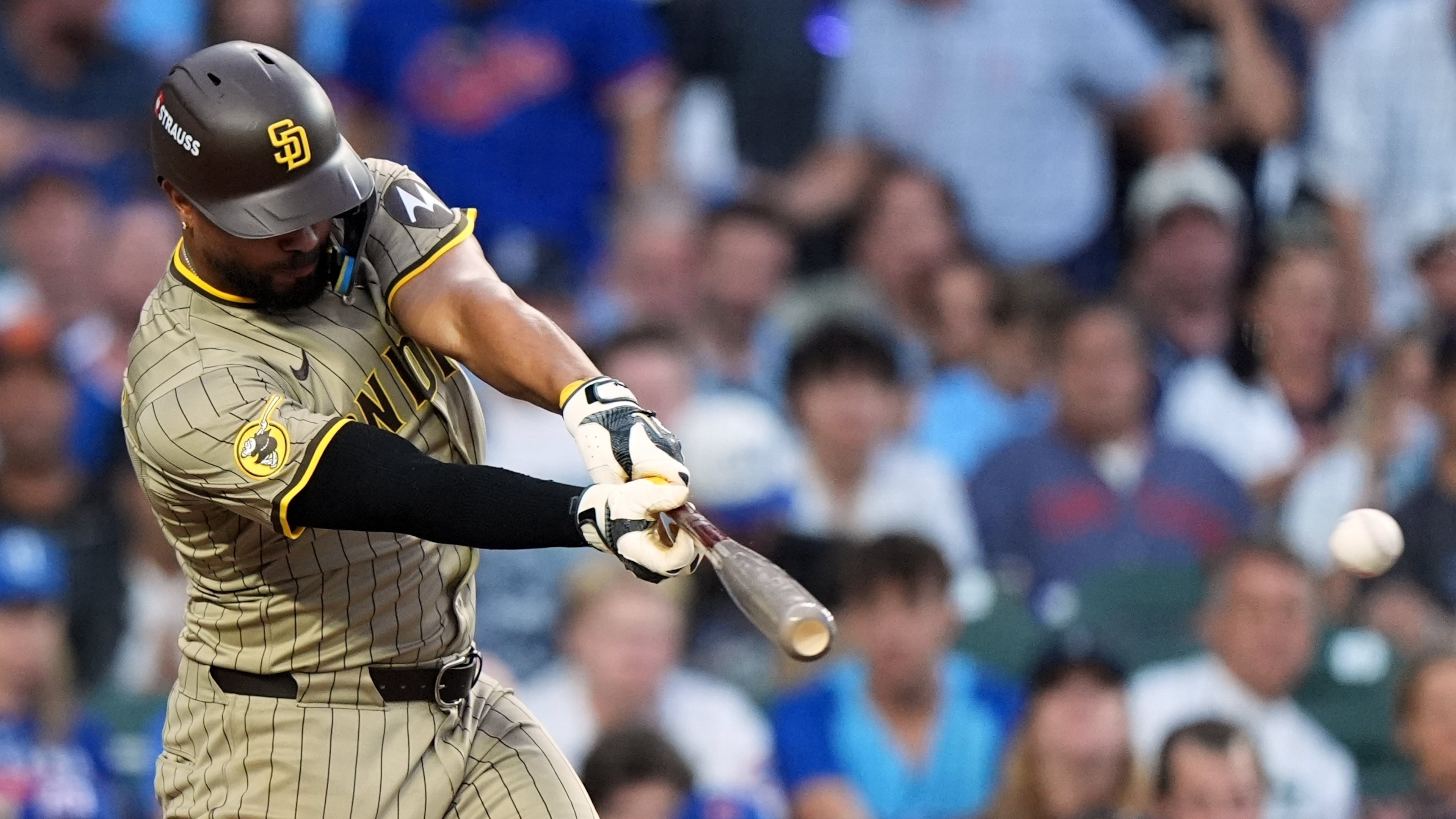 San Diego Padres' Xander Bogaerts hits a single during the seventh inning of Game 3 of a National League wild card baseball game against the Chicago Cubs Thursday, Oct. 2, 2025, in Chicago. (AP Photo/Nam Huh)