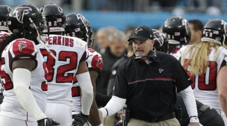 Dan Quinn's Falcons handled their business in Carolina early and then the NFC race fell in their favor later. (AP Photo)