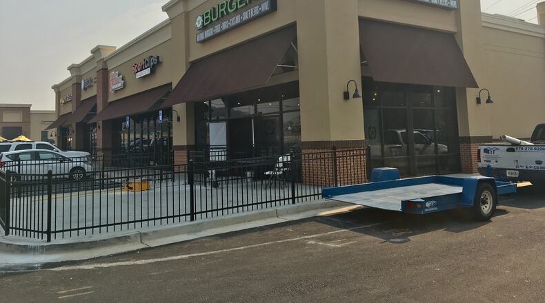 Construction is well underway at a new BurgerFi location on Duluth Highway near Lawrenceville. TYLER ESTEP /TYLER.ESTEP@AJC.COM