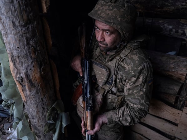 FILE - In this photo provided by Ukraine's 93rd Kholodnyi Yar Separate Mechanized Brigade press service, a soldier looks out of a shelter on the anti-drone firing position in Kostyantynivka, the site of the heavy battles with the Russian troops in the Donetsk region, Ukraine, April 24, 2025. (Iryna Rybakova/Ukraine's 93rd Mechanized Brigade via AP, File)