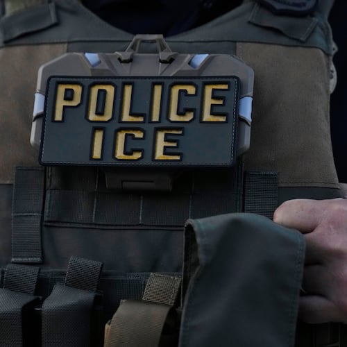 FILE - A U.S. Immigration and Customs Enforcement agent takes part in an early morning operation in Park Ridge, Ill., Sept. 19, 2025. (AP Photo/Erin Hooley, File)