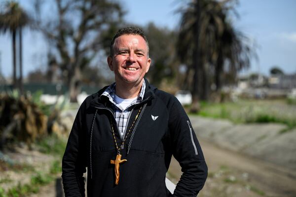 Pastor John Shaver poses for a portrait during a Cross Walk event by the Community United Methodist Church of the Pacific Palisades, Friday, April 18, 2025, in the Pacific Palisades area of Los Angeles. (AP Photo/William Liang)