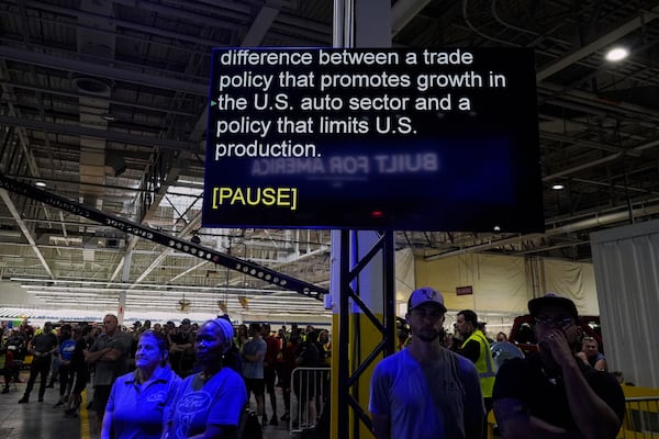 A scrolling teleprompter for Jim Farley, President and Chief Executive Officer of Ford, is seen as he speaks at the Ford Motor Company Kentucky Truck Plant about trade policy during the launch of the 2025 Ford Expedition, Wednesday, April 30, 2025, in Louisville, Ky. (AP Photo/Carolyn Kaster)