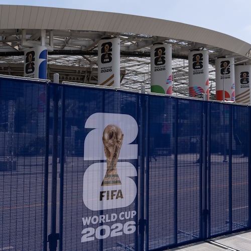 Temporary fencing with FIFA World Cup 2026 signage is set up outside SoFi Stadium, Friday, June 5, 2026, in Inglewood, Calif. (AP Photo/Jae C. Hong)