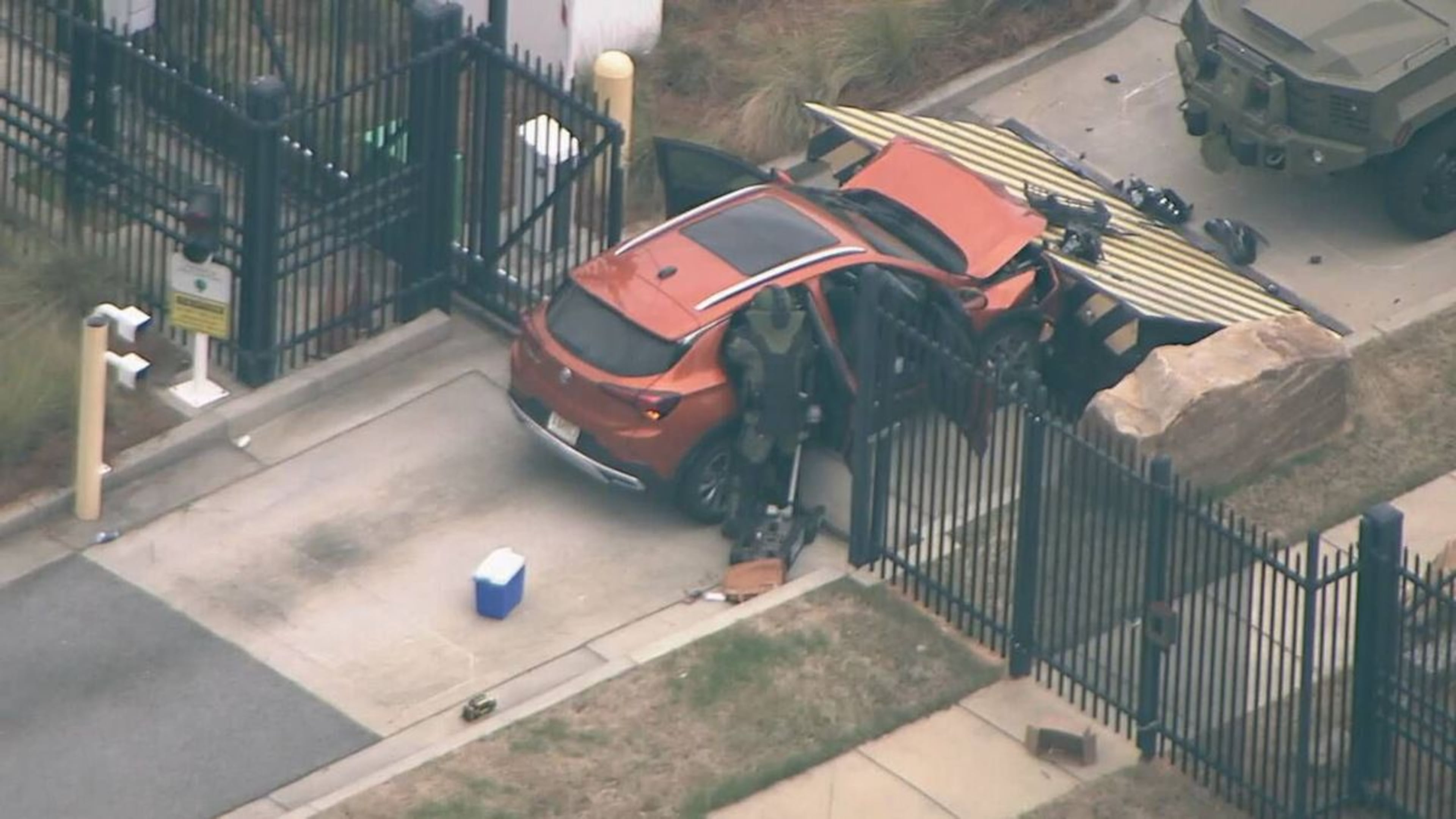 A small SUV rammed into the gate of an FBI office on Flowers Road in Chamblee, officials confirmed, April 1, 2024. (Courtesy of NewsChopper 2)