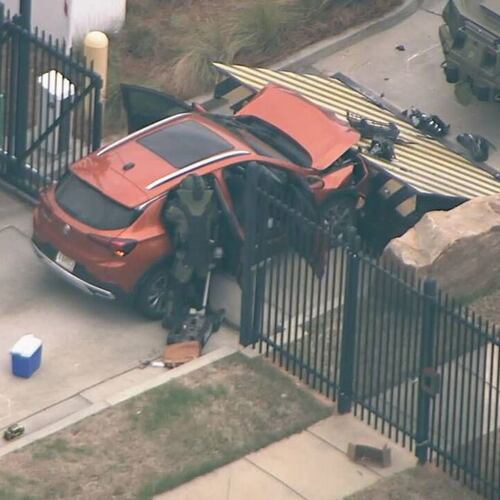 A small SUV rammed into the gate of an FBI office on Flowers Road in Chamblee, officials confirmed, April 1, 2024. (Courtesy of NewsChopper 2)