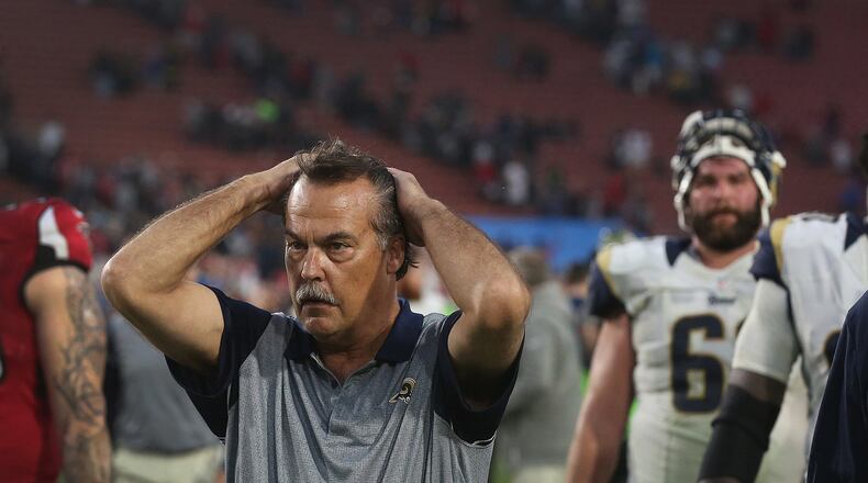 Jeff Fisher, coach of the Los Angeles Rams, walks off the field after a 42-14 blowout loss to the Atlanta Falcons on Sunday, Dec. 11, 2016 at the Los Angeles Memorial Coliseum in Los Angeles, Calif. (Rick Loomis/Los Angeles Times/TNS)
