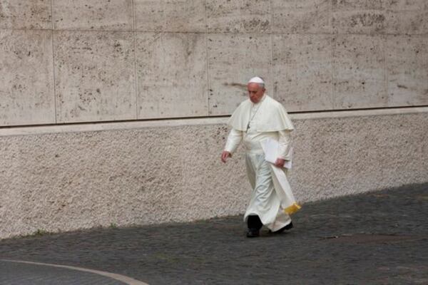 FILE - Pope Francis arrives at the morning session of a two-week synod on family issues, at the Vatican, Thursday, Oct. 16, 2014. (AP Photo/Alessandra Tarantino, file)