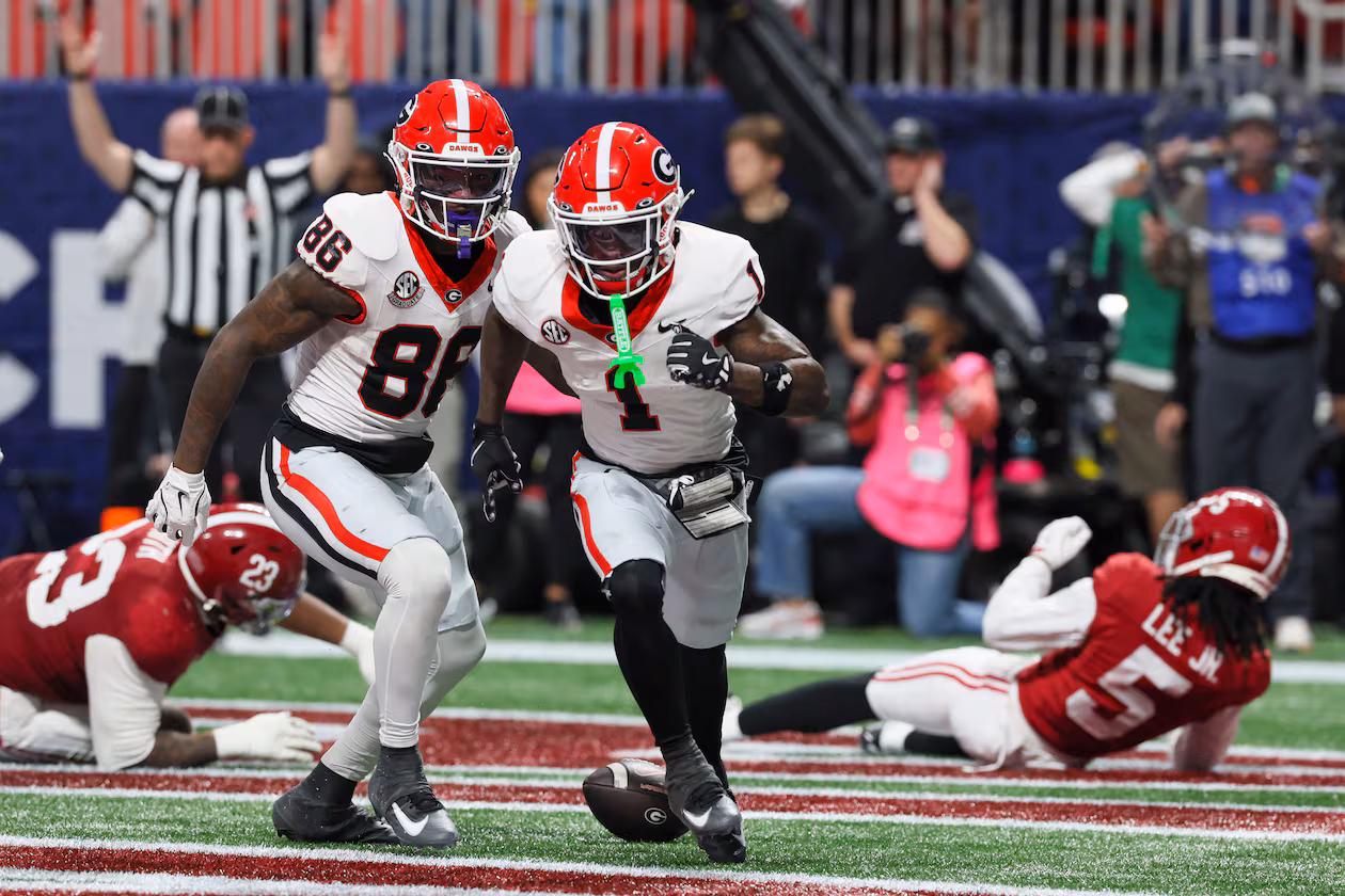 Georgia wide receiver Zachariah Branch (center), shown celebrating after scoring a touchdown against Alabama during the SEC championship game, was nabbed by the Atlanta Falcons with the No. 79 overall pick in the draft. (Jason Getz/AJC 2025)