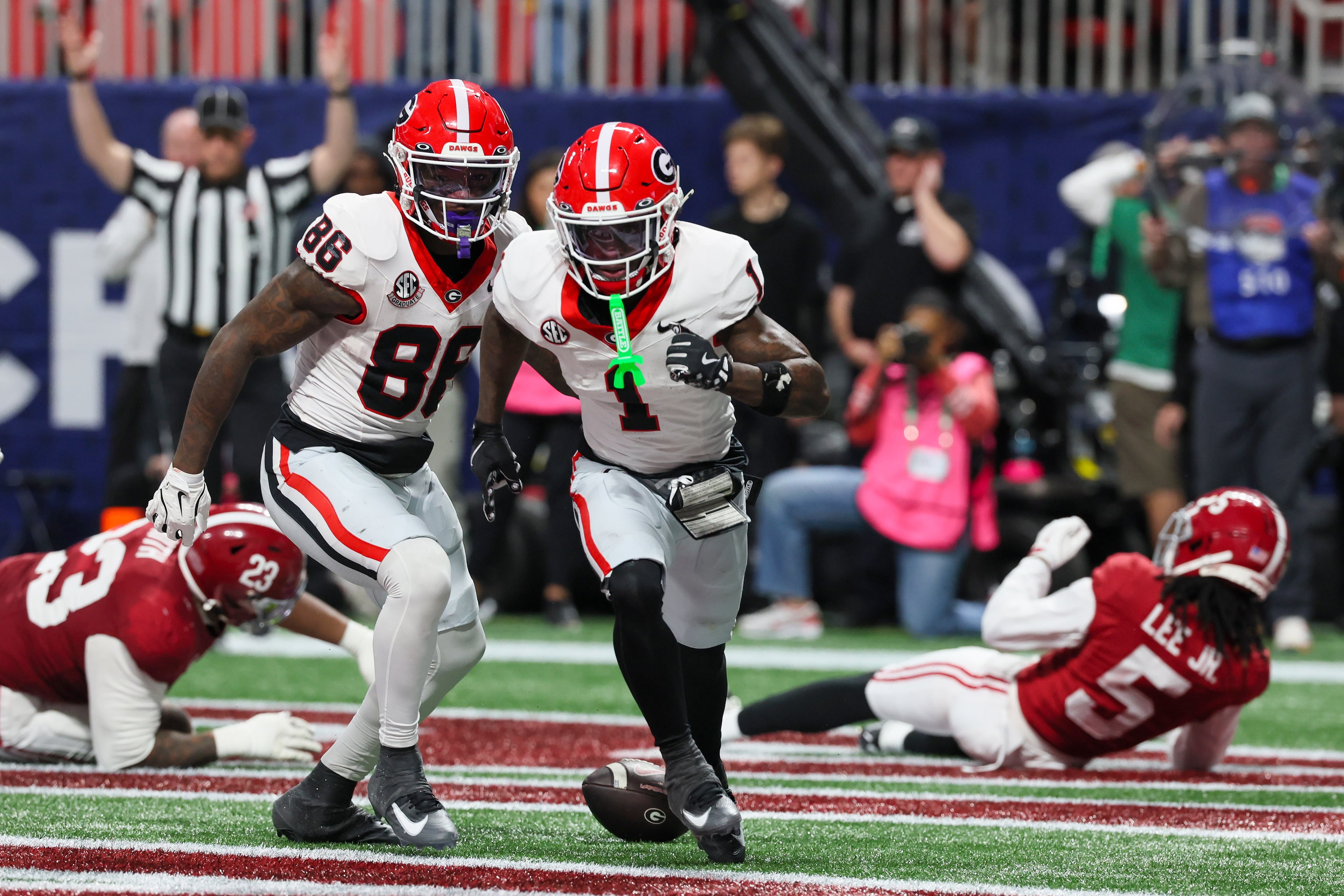 Georgia wide receiver Zachariah Branch (1) reacts after scoring a touchdown against Alabama during the fourth quarter of the SEC Championship game at Mercedes-Benz Stadium, Saturday, Dec. 6, 2025, in Atlanta. (Jason Getz / AJC)