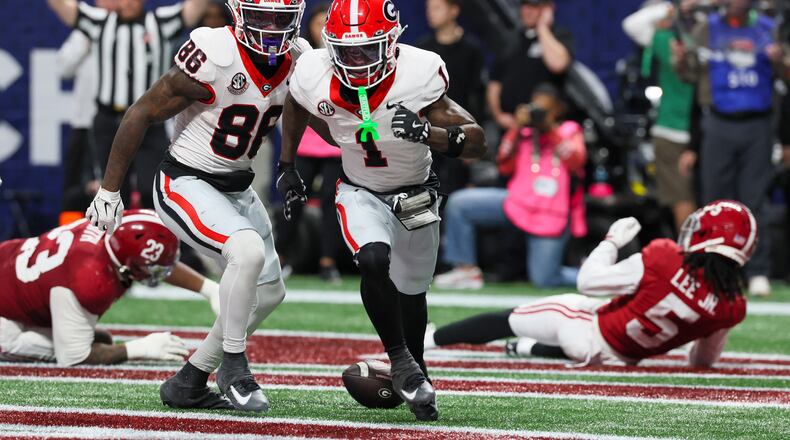 Georgia wide receiver Zachariah Branch (center), shown celebrating after scoring a touchdown against Alabama during the SEC championship game, was nabbed by the Atlanta Falcons with the No. 79 overall pick in the draft. (Jason Getz/AJC 2025)