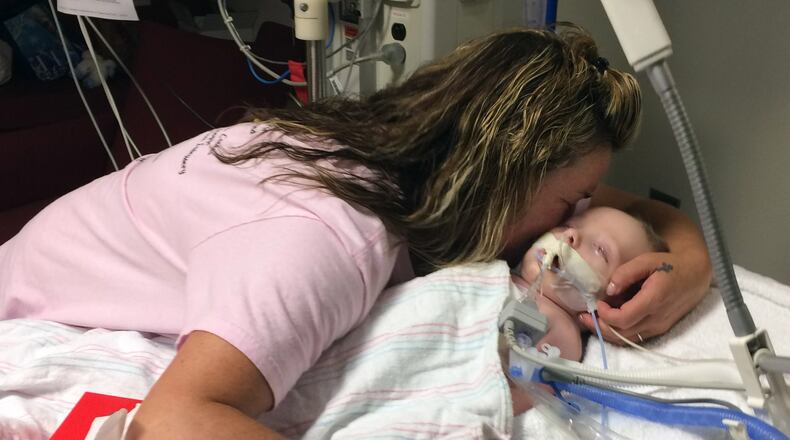 July 14, 2016 - Atlanta - Paige Cason-Barrett, Dinah’s maternal grandmother, spends a moment with Dinah at Children’s Healthcare of Atlanta at Egleston before the baby was taken off life support Monday afternoon. CRAIG SCHNEIDER / Craig.Schneider@ajc.com