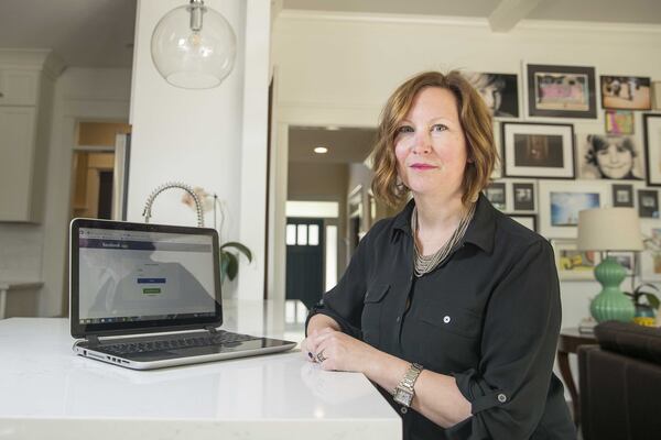 Jennifer Keenan Giliberto, at home in Alpharetta, has scaled back her time on Facebook this year. She wants to be a good role model for her kids at a time when many adults and children spend their days glued to their smartphones and social media accounts.ALYSSA POINTER/ALYSSA.POINTER@AJC.COM