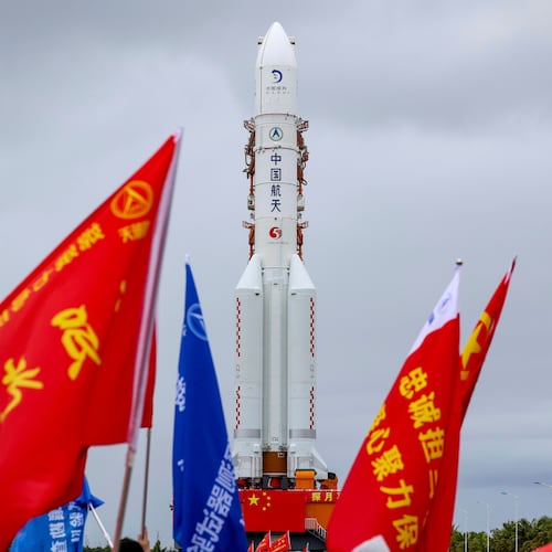 In this photo released by Xinhua News Agency, the combination of the Chang'e-7 lunar probe and the Long March-5 Y14 carrier rocket is transferred vertically to the launching area at the Wenchang Spacecraft Launch Site in southern China's Hainan Province on Wednesday, Aug. 19, 2026 . (Yang GuanyuXinhua via AP)