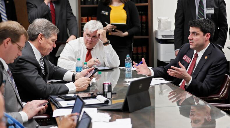 2/20/18 - Atlanta - Rep.Chuck Efstration (right), the governor's floor leader, presents HB 918, the governor's income tax proposal,  before the  Ways & Means Income Tax Subcommittee.   Gov. Nathan Deal and legislative leaders announced Tuesday a compromise plan for dealing with the massive state windfall created by the federal tax law, calling for a reduction in the state income tax rate and an increase in the standard deduction.  BOB ANDRES  /BANDRES@AJC.COM