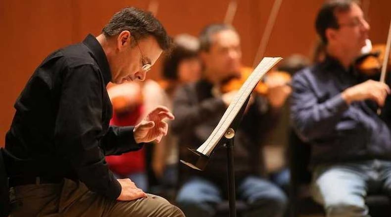 Atlanta composer Richard Prior listens intently as Atlanta Symphony Orchestra music director Robert Spano conducts the first rehearsal of Prior’s Symphony No. 3 in Symphony Hall in this AJC file photo.