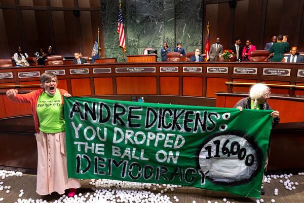 Opponents of the under-construction law enforcement training center, known to some as Cop City, disrupt the City Council meeting at City Hall in Atlanta on Monday, Sept. 16, 2024. It’s been one year since opponents submitted a petition to force a referendum to block the project. (Arvin Temkar/AJC)