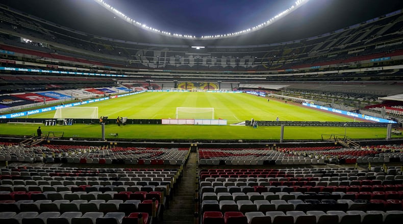 FILE - The stands of the Azteca stadium are seen empty of fans prior a World Cup Qatar 2022 qualifying soccer match between Mexico and Jamaica, in Mexico City, Thursday, Sept. 2, 2021. (AP Photo/Eduardo Verdugo, File)