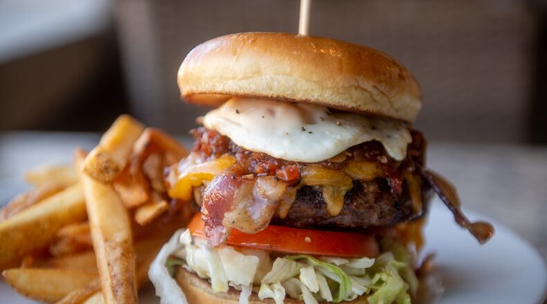 Gwinnett County restaurants will offer speciality $7 burgers by taking part in the annual Gwinnett Burger Week, including this one, the Towne Center burger by Firebirds Wood Fired Grill in Peachtree Corners. (Courtesy of Firebirds Wood Fired Grill)