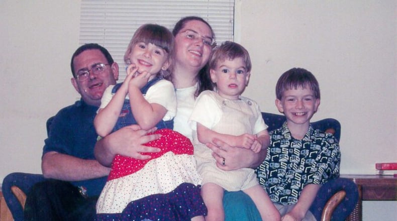 Elwyn Crocker Sr. and his wife Candice Crocker pose with the husband's kids, from left, Mary, James and JR in a 2010 photo posted publicly on the dad's Facebook page.