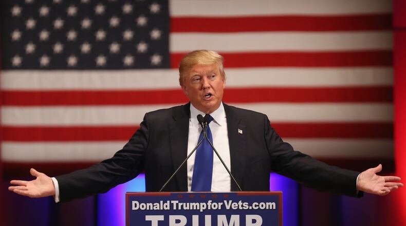 DES MOINES, IA - JANUARY 28: Republican presidential candidate Donald Trump gestures as he speaks to veterans at Drake University on January 28, 2016 in Des Moines, Iowa. Donald Trump held his alternative event to benefit veterans after withdrawing from the televised Fox News/Google GOP debate which airs at the same time. (Photo by Christopher Furlong/Getty Images)