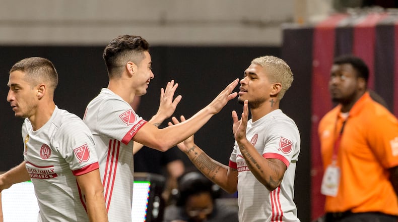Atlanta United's Josef Martinez is congratulated after scoring a goal against New England on Wednesday at Mercedes-Benz Stadium. (Eric Rossitch / Atlanta United)