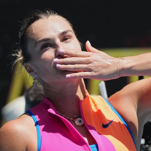Aryna Sabalenka of Belarus celebrates after defeating Bai Zhuoxuan of China in their second round match at the Australian Open tennis championship in Melbourne, Australia, Wednesday, Jan. 21, 2026. (AP Photo/Dita Alangkara)