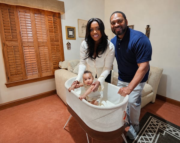 Briana and Amos Faucette are grateful for restful sleep through the SNOO bassinet for their son, Asher, provided by the city of Atlanta as an employee benefit. (Courtesy of Betty J. Barnes)