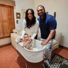 Briana and Amos Faucette are grateful for restful sleep through the SNOO bassinet for their son, Asher, provided by the city of Atlanta as an employee benefit. (Courtesy of Betty J. Barnes)