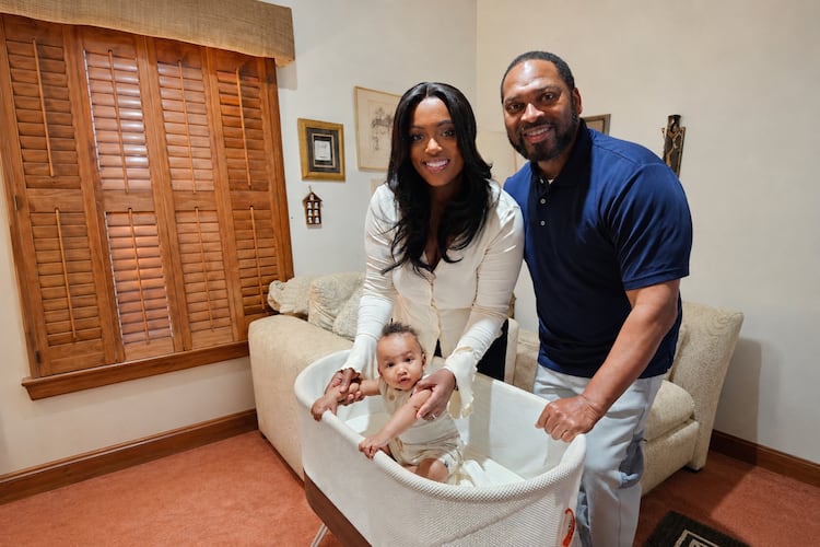 Briana and Amos Faucette are grateful for restful sleep through the SNOO bassinet for their son, Asher, provided by the city of Atlanta as an employee benefit. (Courtesy of Betty J. Barnes)