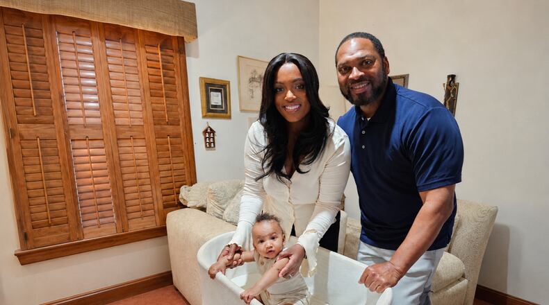 Briana and Amos Faucette are grateful for restful sleep through the SNOO bassinet for their son, Asher, provided by the city of Atlanta as an employee benefit. (Courtesy of Betty J. Barnes)
