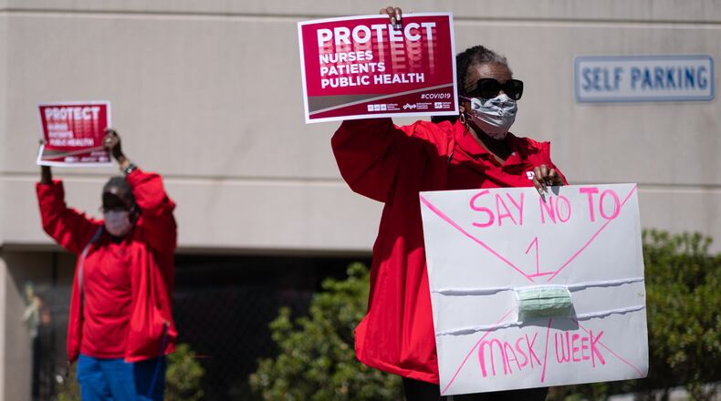 Nurses frustrated by a lack of N95 masks and other protective equipment took part in a protest earlier this month organized by the National Nurses United union, held outside the Atlanta VA Medical Center where they work. One nurse working among sick and dying coronavirus patients said she had been using the same N95 mask for two weeks. Another held up a sign to passing cars that said, “Say no to 1 mask/week.” Ben@BenGray.com for the Atlanta Journal-Constitution