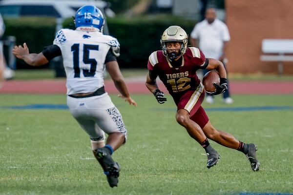 Stephenson long snapper Kaiden Gooden (left) defends a punt return by Tucker's Jayden Joyner on Friday, Sept. 4, 2026, in Clarkston. (Erik S. Lesser for the AJC)