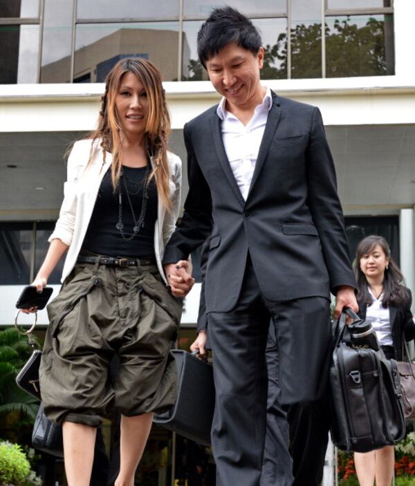 City Harvest Church founder Kong Hee with his pop-singer wife Ho Yeow Sun on September 9, 2013. (Photo credit ROSLAN RAHMAN/AFP/Getty Images)
