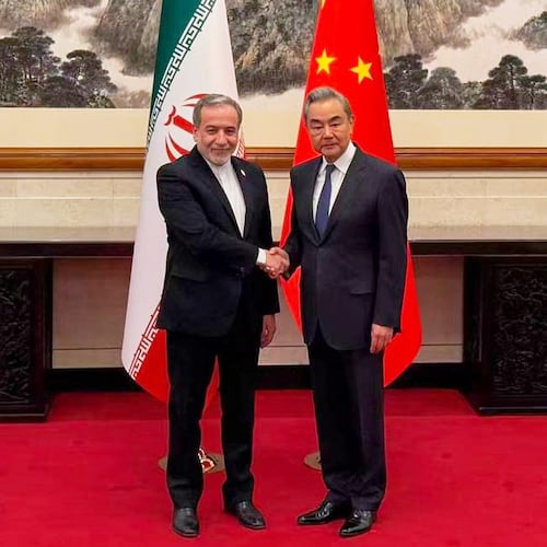 In this photo released by the Telegram channel of Iranian Foreign Minister Abbas Araghchi, China's Foreign Minister Wang Yi, right, meets with Iran's Foreign Minister Abbas Araghchi in Beijing, China, Wednesday, May 6, 2026. (Telegram channel of the Iranian Foreign Minister via AP)