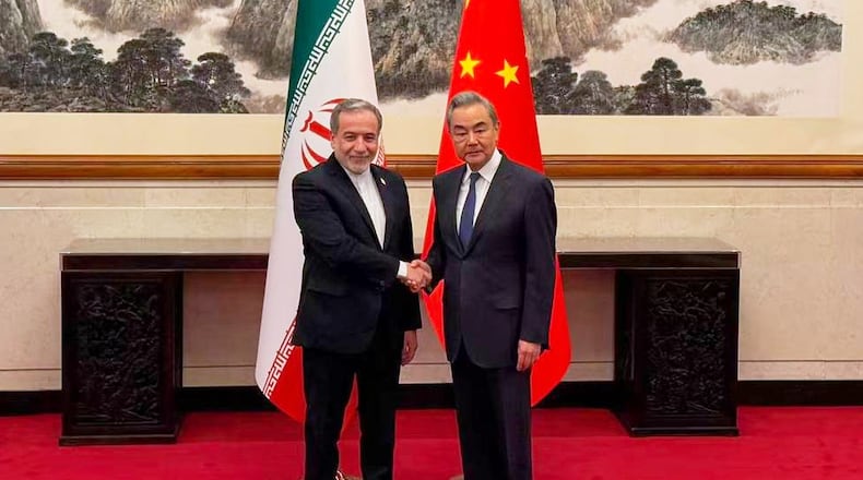 In this photo released by the Telegram channel of Iranian Foreign Minister Abbas Araghchi, China's Foreign Minister Wang Yi, right, meets with Iran's Foreign Minister Abbas Araghchi in Beijing, China, Wednesday, May 6, 2026. (Telegram channel of the Iranian Foreign Minister via AP)
