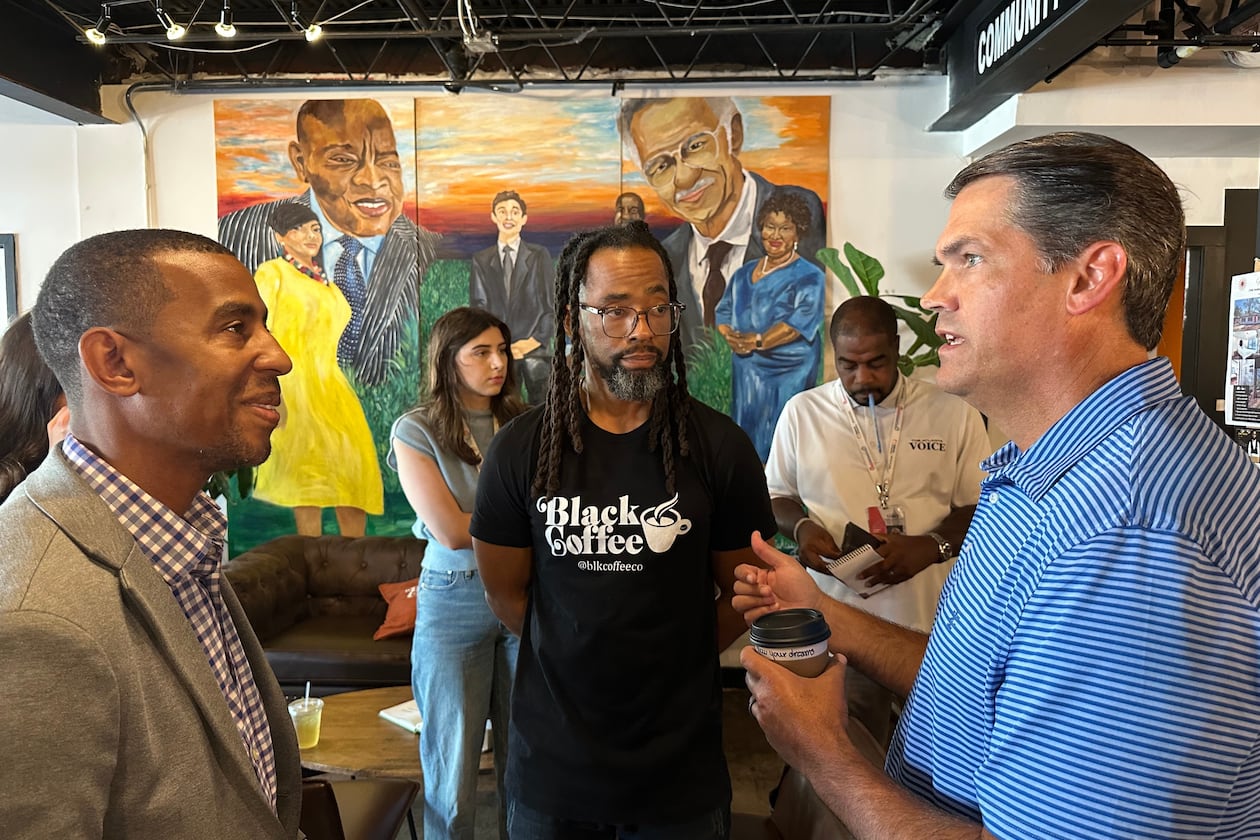 Former Republican Lt. Gov. Geoff Duncan (right) speaks about his Democratic campaign for governor Sept. 17, 2025, at Black Coffee Co., in Atlanta. (Jeff Amy/AP)