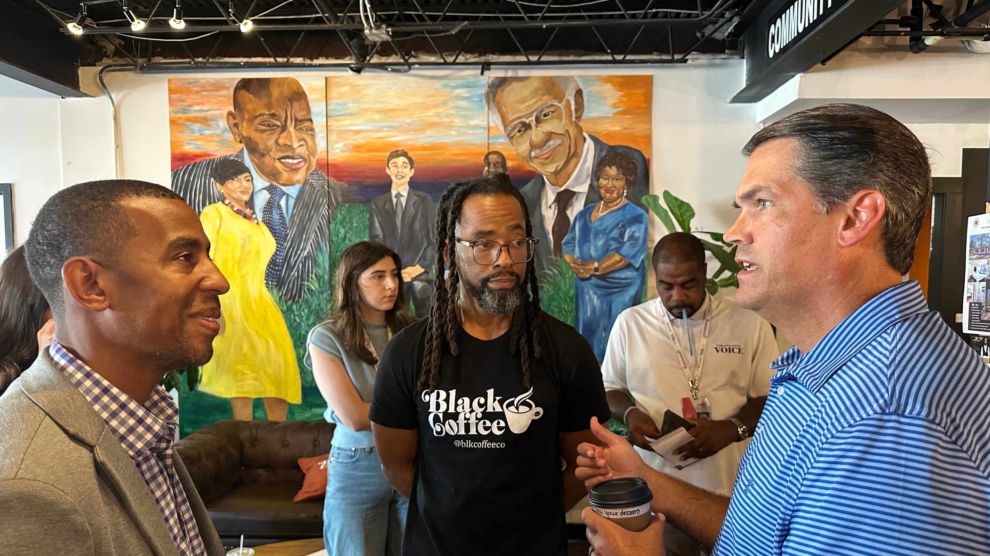 Former Republican Lt. Gov. Geoff Duncan (right) speaks about his Democratic campaign for governor Sept. 17, 2025, at Black Coffee Co., in Atlanta. (Jeff Amy/AP)