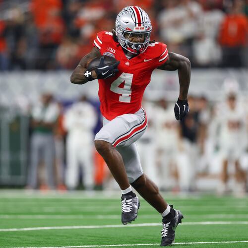 FILE - Ohio State wide receiver Jeremiah Smith runs the ball against Miami during the second half of the Cotton Bowl College Football Playoff quarterfinal game, Dec. 31, 2025, in Arlington, Texas. (AP Photo/Gareth Patterson, File)