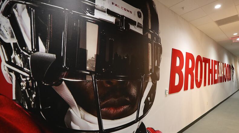 The hallway into the Falcons locker room bears the Brotherhood logo at Mercedes-Benz Stadium during an open house tour on Monday, August 15, 2017, in Atlanta.  Curtis Compton/ccompton@ajc.com