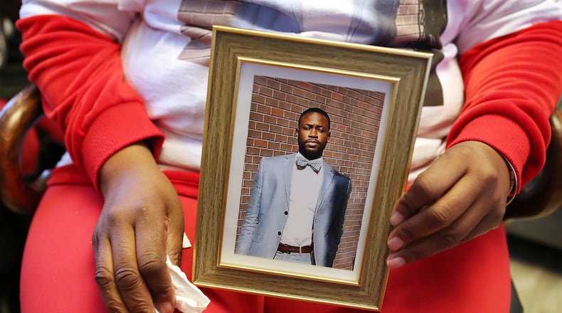 013121 Stone Mountain: Janet Morris holds a photograph of her son Jireh Morris, who was killed in a December shooting at a DeKalb County apartment complex, during an interview at the family home on Sunday, Jan. 31, 2021, in Stone Mountain.    Curtis Compton / Curtis.Compton@ajc.com”