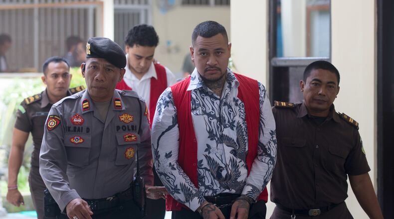 Australian nationals Paea I Middlemore Tupou, foreground center and Mevlut Coskun, rear, who are on trial for the fatal shooting of an Australian tourist last year, arrive for their sentencing hearing at the district Court in Denpasar, Bali, Indonesia, Monday, March 9, 2026. (AP Photo/Firdia Lisnawati)